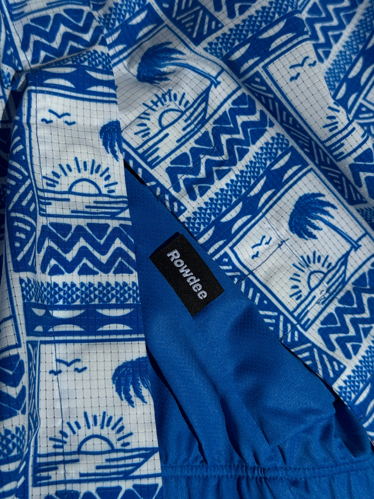 Blue and white patterned fabric with a Rowlee label